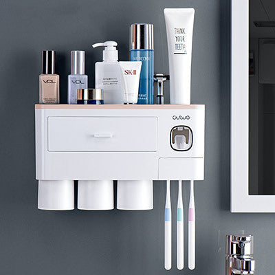 Non-marking hanging magnetic toothbrush holder with single drawer, toothpaste squeezer, and toiletry storage rack