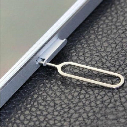 SIM card slot card taking pin compatible accessory close-up