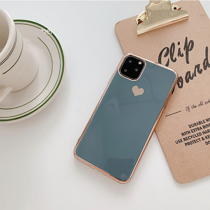 Luxury plating love phone case with glossy gold finish and heart design encased on a smartphone