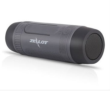 LED flashlight and speaker bike mount handlebar accessory, black design with integrated light and speaker encased in durable housing