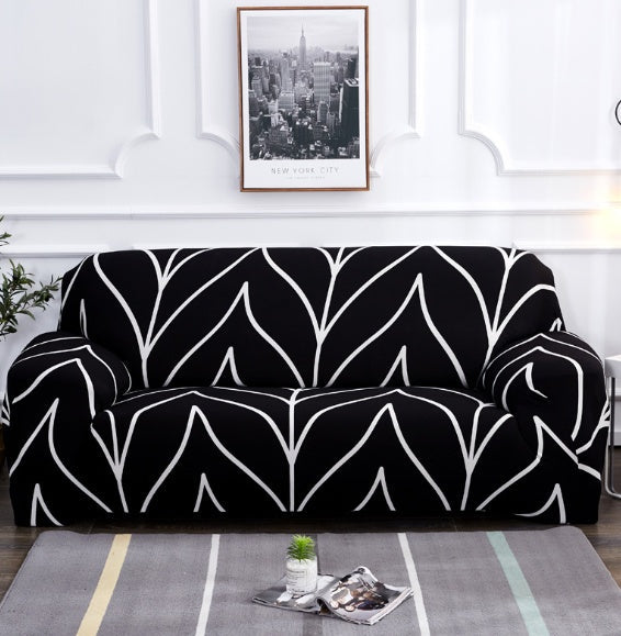 Elastic universal sofa cover in neutral fabric, fitted over a sofa for full furniture protection