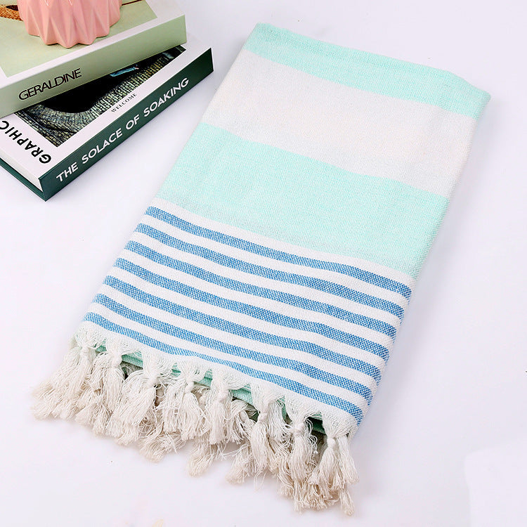 Striped cotton beach towel, 100x180cm, displayed flat in alternating stripes