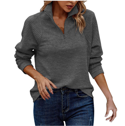 Loose solid-color sweatshirt with stand collar, front zipper, and snake bone pattern details