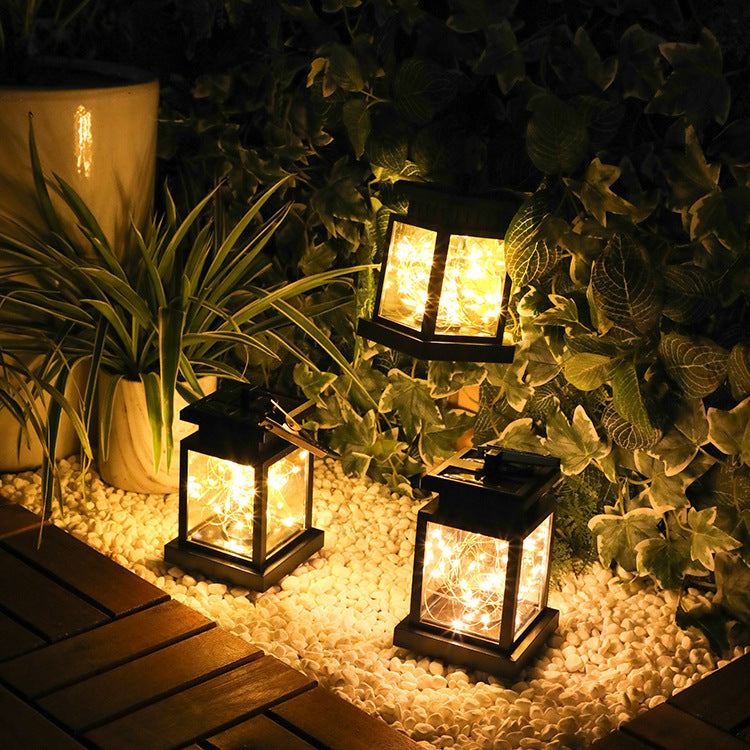 Solar wind lamp with decorative design and solar-powered outdoor lighting; brand not visible