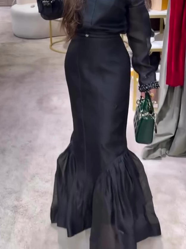 Black structured organza mermaid maxi skirt by My Store, showcasing a fitted silhouette and flared hem