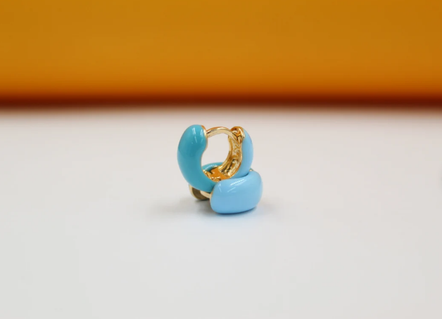 18K gold filled enamel small huggie earrings by MIA Jewelry, showcasing vibrant colored enamel on shiny gold hoops.