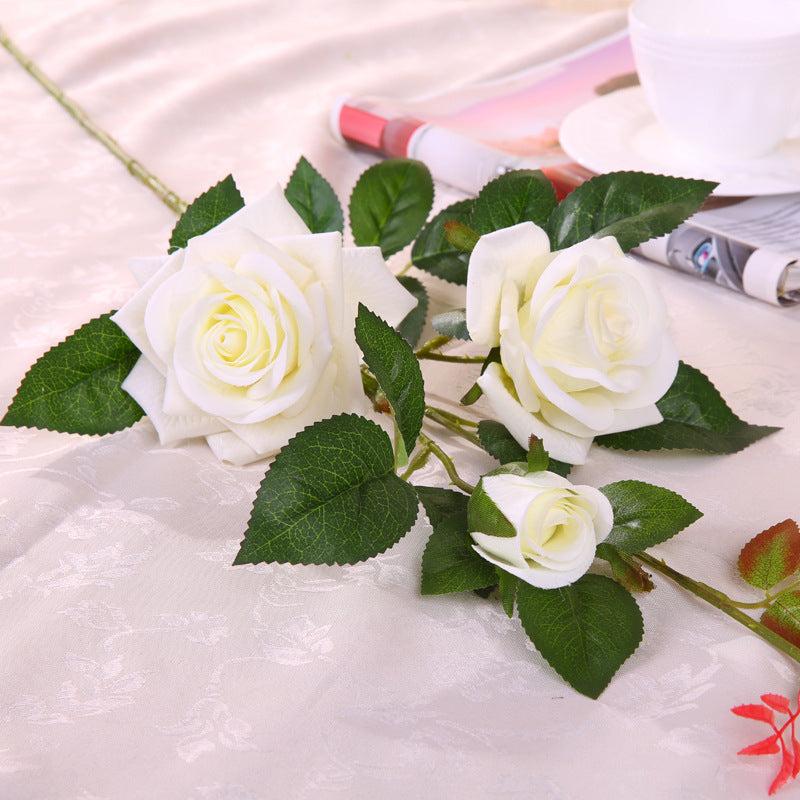 Artificial rose flower with realistic petals and green stem