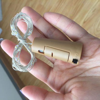 Button battery box LED light with compact battery compartment and LED illumination.