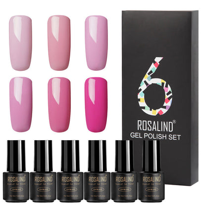 Six Fine nail polish bottles in assorted colors arranged together