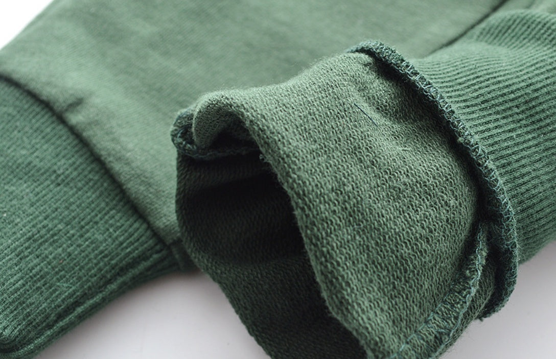 Children's knitted trousers in a soft, textured knit fabric.