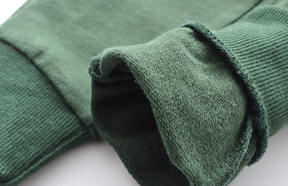 Children's knitted trousers in a soft, textured knit fabric.