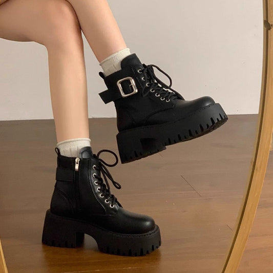 Women's ankle boots with laces and height-increasing design, shown in a classic silhouette