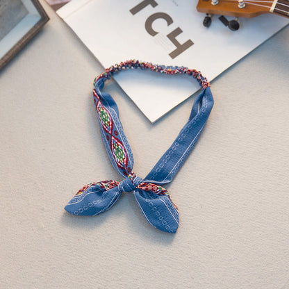 Big bow tie bunny ears headband by My Store on a plain background