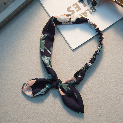 Big bow tie bunny ears headband with playful rabbit ear design