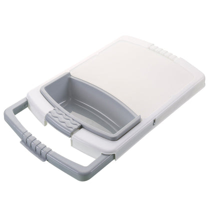Kitchen drain cutting board with built-in drainage area and food preparation surface on countertop