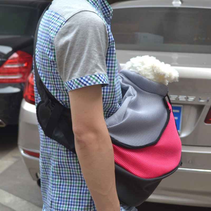 Pet backpack carrier with padded straps and breathable mesh panels, suitable for carrying small pets.