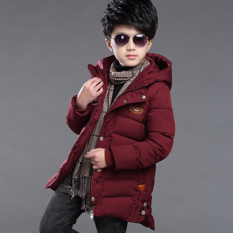 Boy's hooded padded jacket in a warm quilted design with attached hood, front zipper, and long sleeves