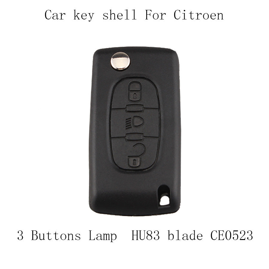 Peugeot car key viewed from above with visible key blade and button fob design