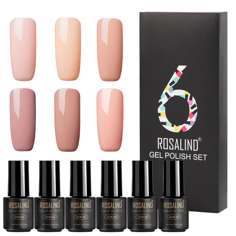 Six bottles of fine nail polish in assorted colors displayed together
