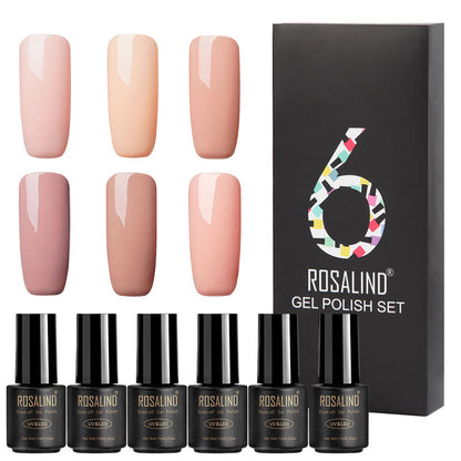 Six bottles of fine nail polish in assorted colors displayed together