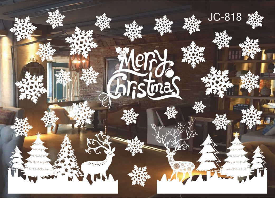Christmas decorations store window stickers in festive holiday designs displayed on a glass window