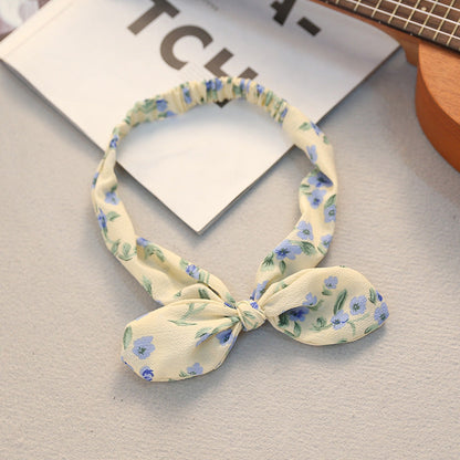 Big bow tie bunny ears headband with soft pink ears and oversized bow detail