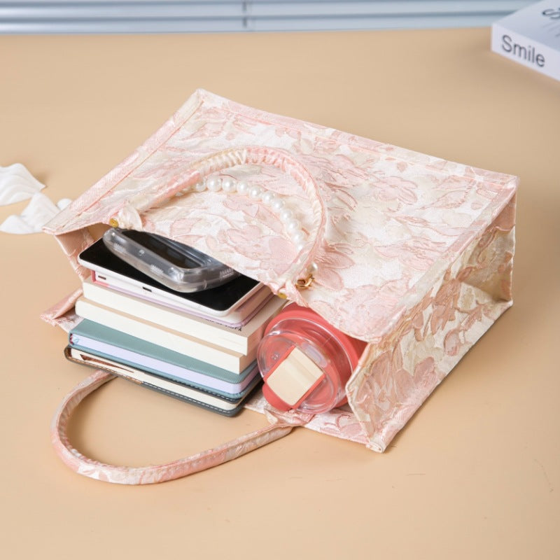 Relief-printed souvenir canvas gift bag with textured design and sturdy fabric handles
