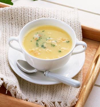 Cream of chicken soup packet by AmBari Nutrition with 15g protein, showcasing a creamy, thick soup in a bowl.