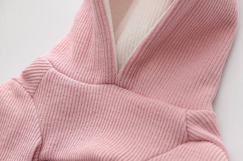 Small dog knitted sweater with rabbit ears costume in soft pink yarn