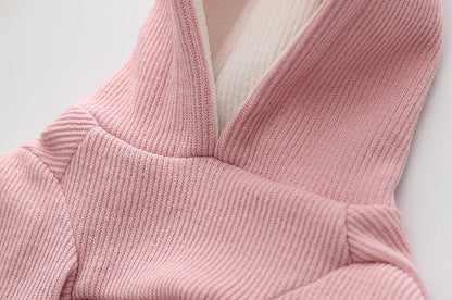 Small dog knitted sweater with rabbit ears costume in soft pink yarn