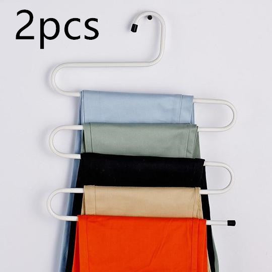 Magic non-slip S-type home pants rack with curved hooks for organizing trousers and clothing.