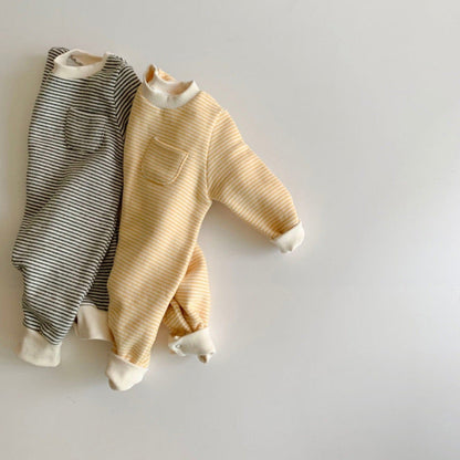 Striped baby jumpsuit worn outdoors, showing soft fabric and comfortable fit