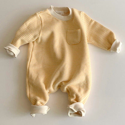 Striped baby jumpsuits worn outdoors, featuring soft fabric and playful patterns