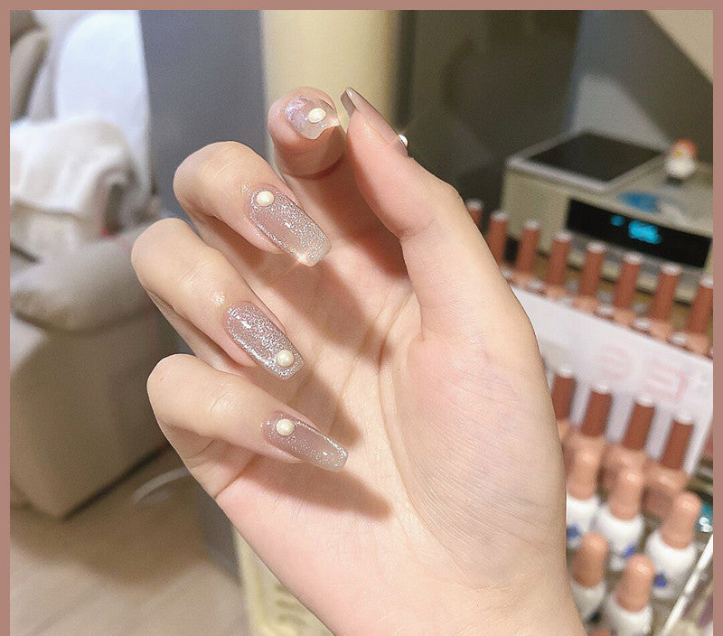 Milk tea crystal stone cat eye nail polish bottle in soft beige shimmer tones