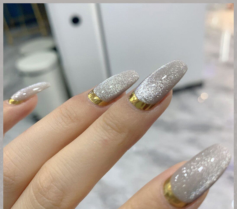 Milk Tea Crystal Stone Cat Eye Nail Polish bottle with shimmering beige polish and magnetic cat-eye effect