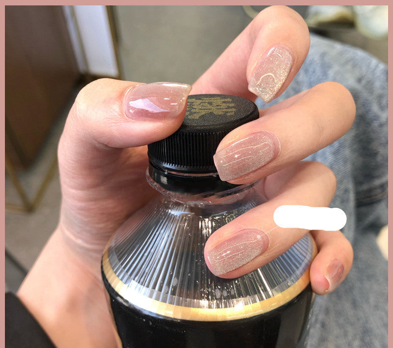 Milk Tea Crystal Stone Cat Eye Nail Polish bottle with shimmering magnetic finish in soft beige tone