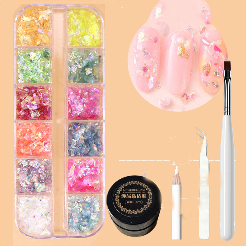 Metal rivets and rhinestone nail decorations in a mixed box, assorted shapes and finishes visible