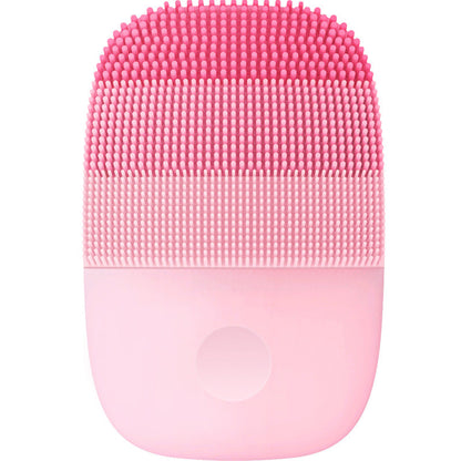 Electric facial cleanser with ergonomic handle and soft silicone brush head in white and pink