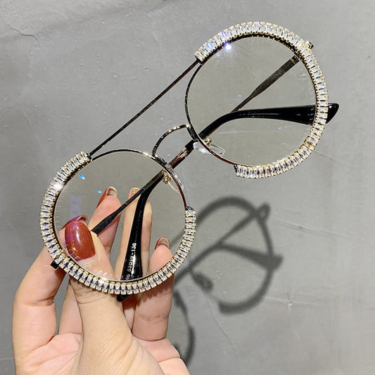 Retro round sunglasses with black frames and tinted lenses close-up