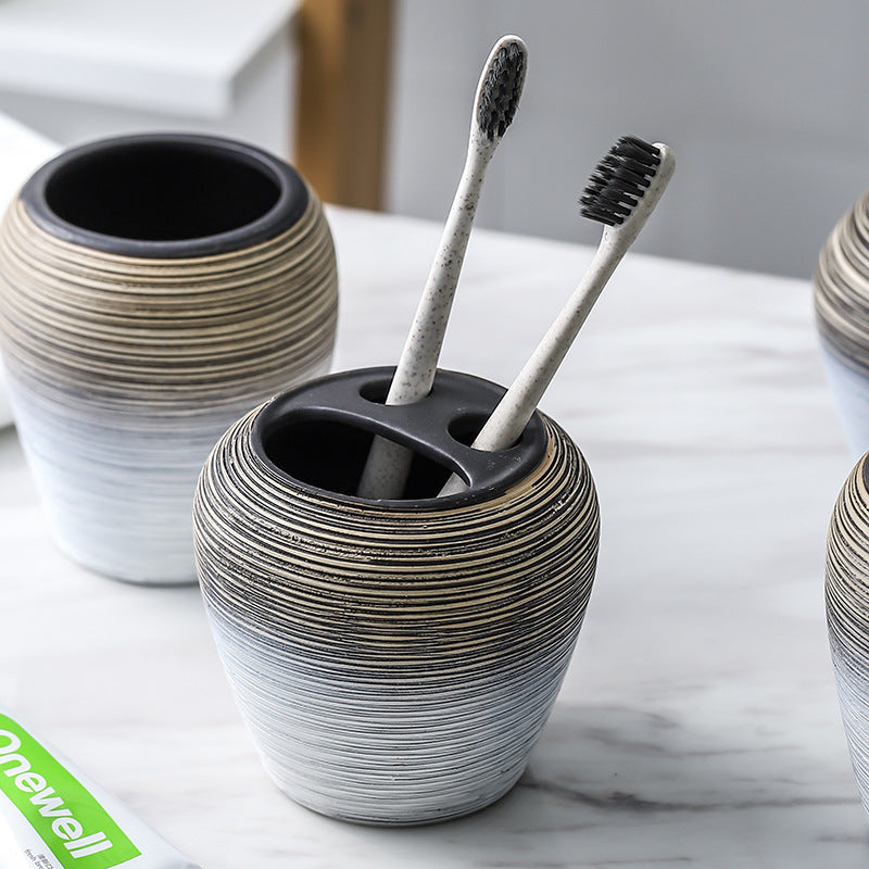 Retro brushed bathroom wash set with brushed finish, including basin tap and matching bathroom accessories