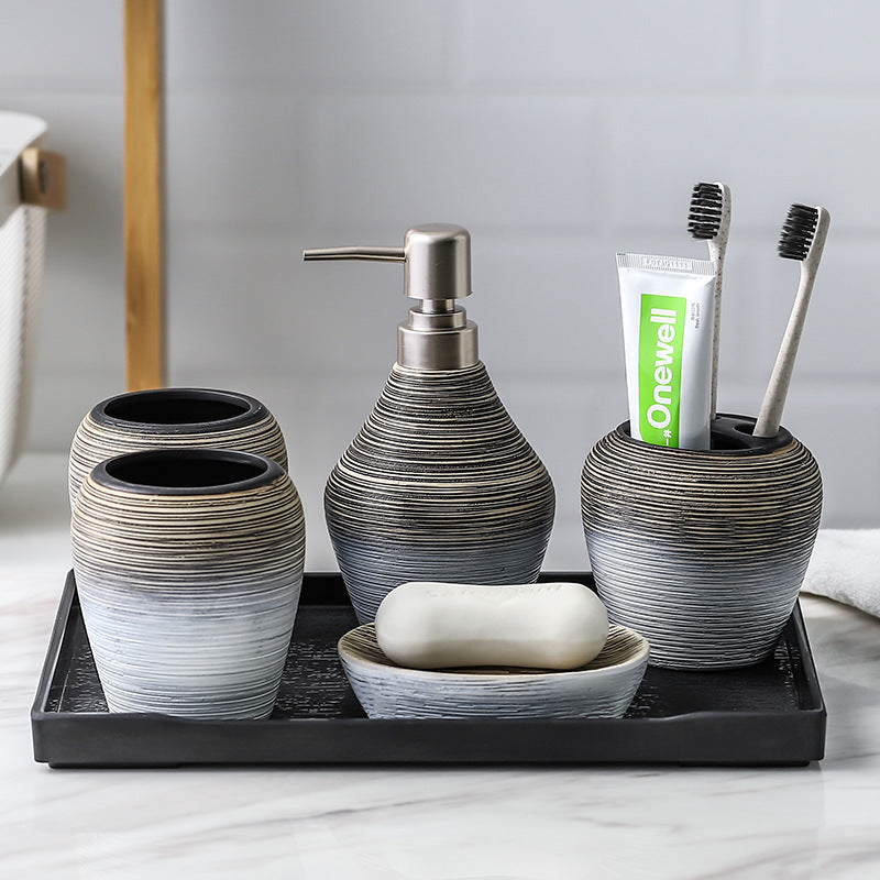 Retro brushed bathroom wash set in brushed metal finish, including tap and matching basin fittings