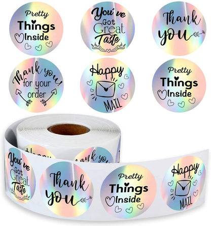 Rainbow laser sticker label roll with iridescent finish, shown in a close-up product image