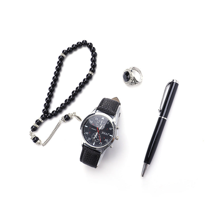 Boutique gift set with ring, rosary, quartz watch, and pen displayed together