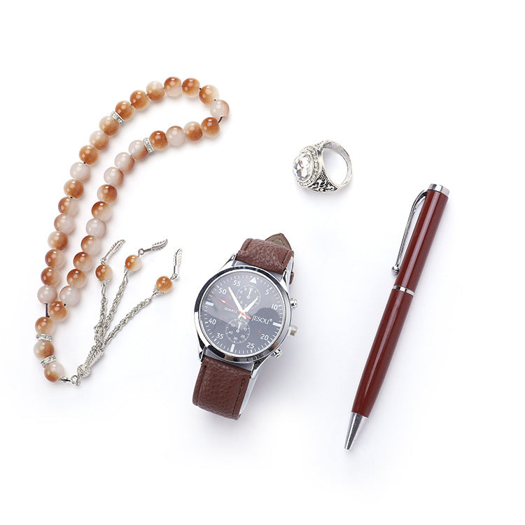 Boutique gift set with ring, rosary, quartz watch, and pen in a coordinated presentation
