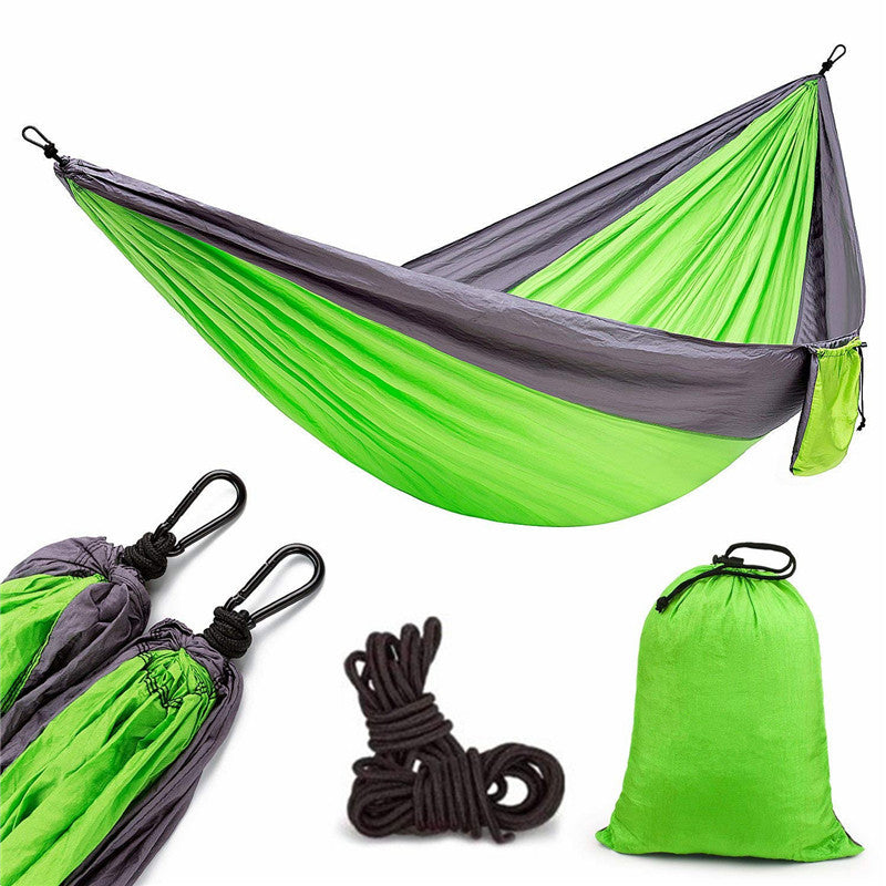 Portable nylon parachute backpacking double hammock suspended outdoors