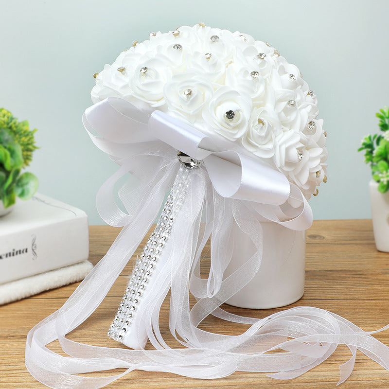Handmade artificial wedding bouquet with realistic rose flowers in a romantic arrangement