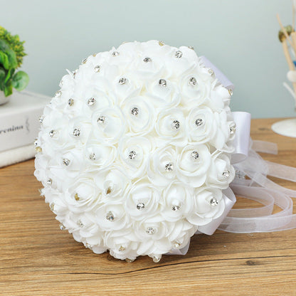 Handmade artificial wedding bouquet with realistic rose flowers in a romantic arrangement