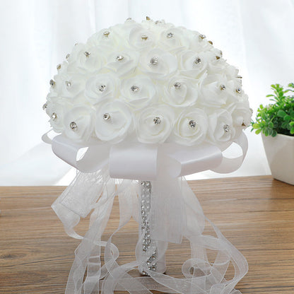 Handmade artificial wedding bouquet with realistic rose flowers in a romantic arrangement