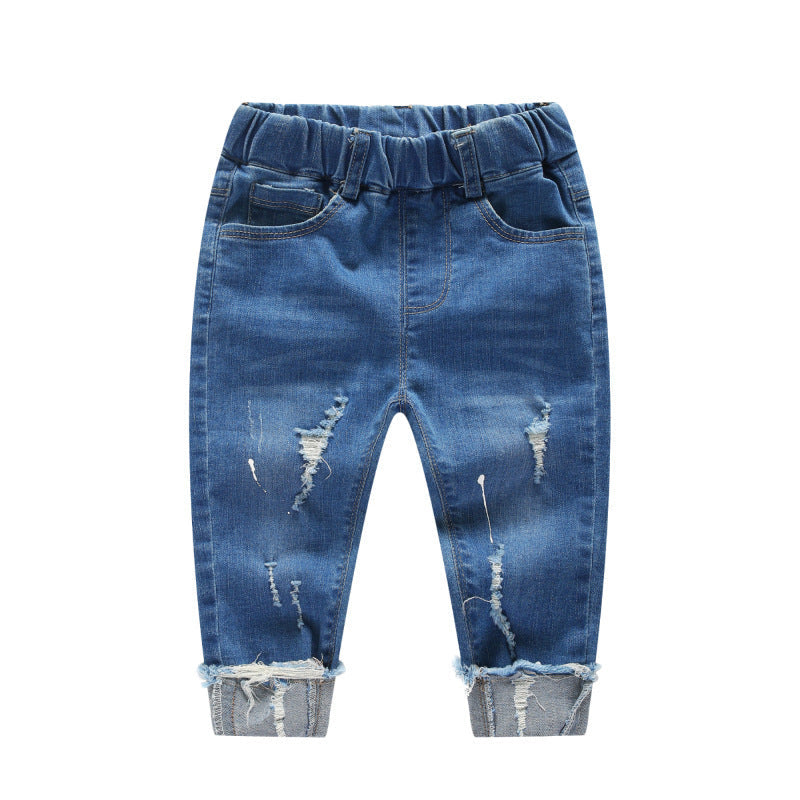 Children's boy ripped denim pants in blue with distressed details