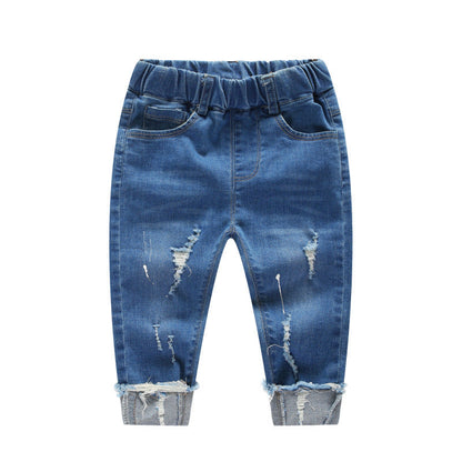 Children's boy ripped denim pants in blue with distressed details